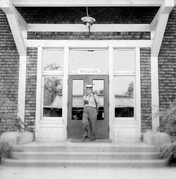 Konstantin standing below a viticulture sign.