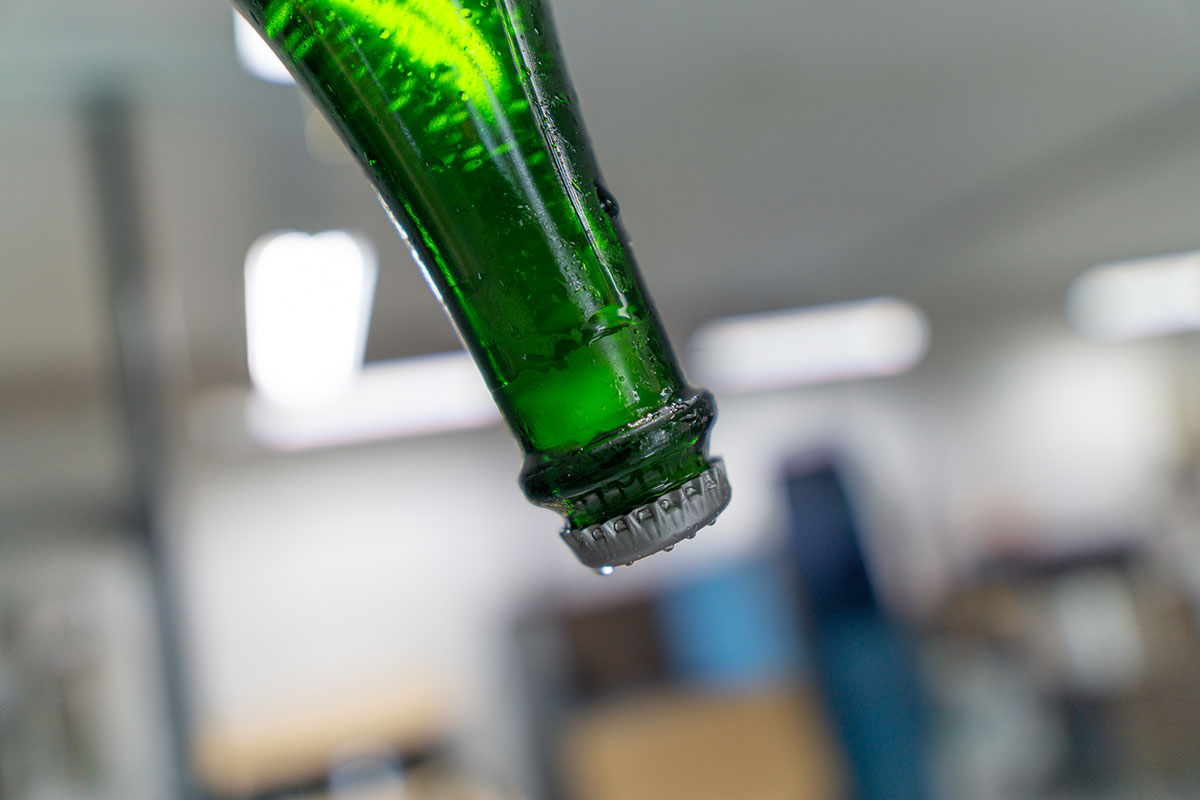 Ice plug in a wine bottle held upside down.