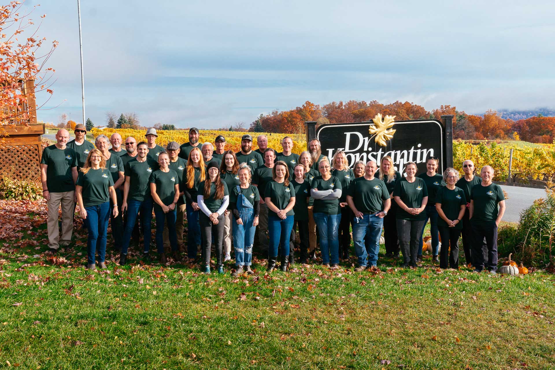 Staff photo in front of Dr. Konstantin Frank Sign.